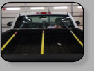 For a sensable no drama installation, a vertically set rear back window glass such as this GMC pickup needs to be  held in place until the adhesive completely cures