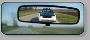 An example of a car or truck, interior rear view mirror with manual day night operation.