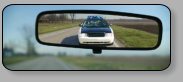 An example of a car or truck, interior rear view mirror with manual day night operation.