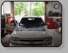 A Chevrolet Tahoe suffering from Poor Workmanship from its prior windshield installation.