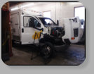 A Chevrolet C4500 with rusty pinchweld  from a prior poor windshield installation.