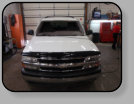 A Chevy Tahoe with a rusty pinchweld from a former poor windshield installation.