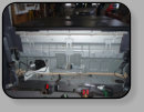 A Ford Sport Trac pick up truck power rear window back glass has a cable type window regulator and the broken tempered glass can not be cleaned out with out compressed air.