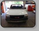 A hack job replacement windshield installation in a GMC Sierra C 1500 Pickup