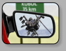 The passenger side mirror is optional as long as there is a field of vision from using an inside rearview mirror.  It can be flat or convex and if it is a convex mirror, the insignia “Objects are closer than they appear” must be inscribed on the mirror.