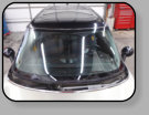 A Mini Cooper prior replacement windshield installation that was hacked from A to Z.